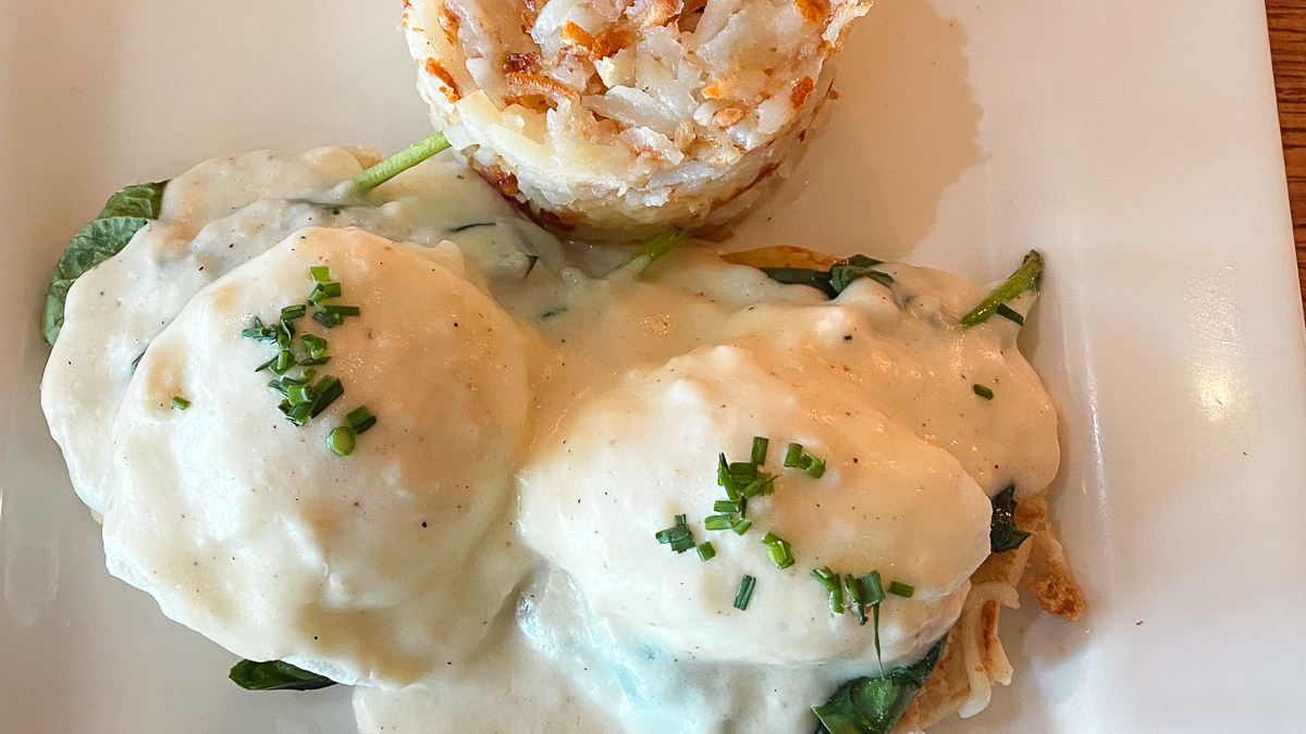 Florentine benedict, eggs topped with hollandaise with a hashbrown, at Patrick's Bakery and Cafe in Edina, MN.