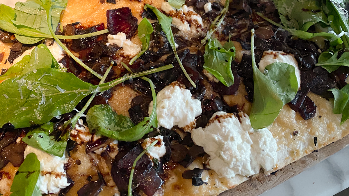 Mushroom flatbread with goat cheese and greens at CoV Edina.